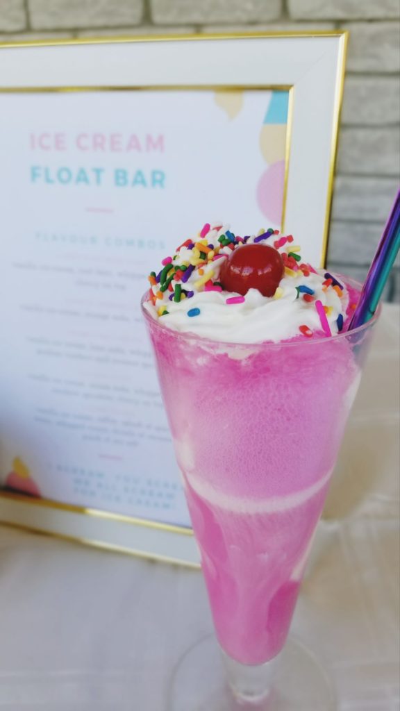 pink ice cream float and sign