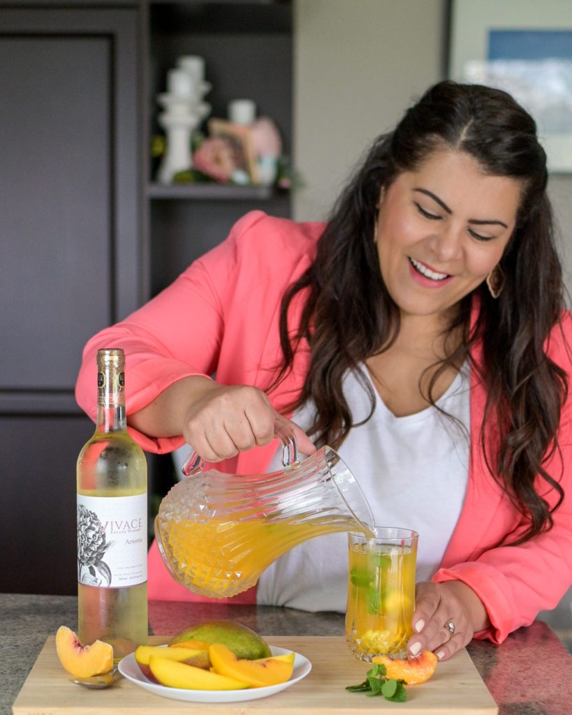 mara pouring mango peach sangria