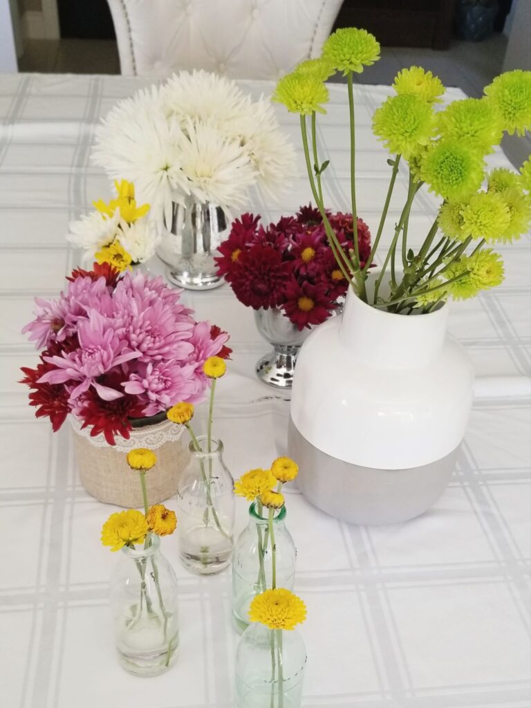 grocery store mums arranged on thanksgiving table