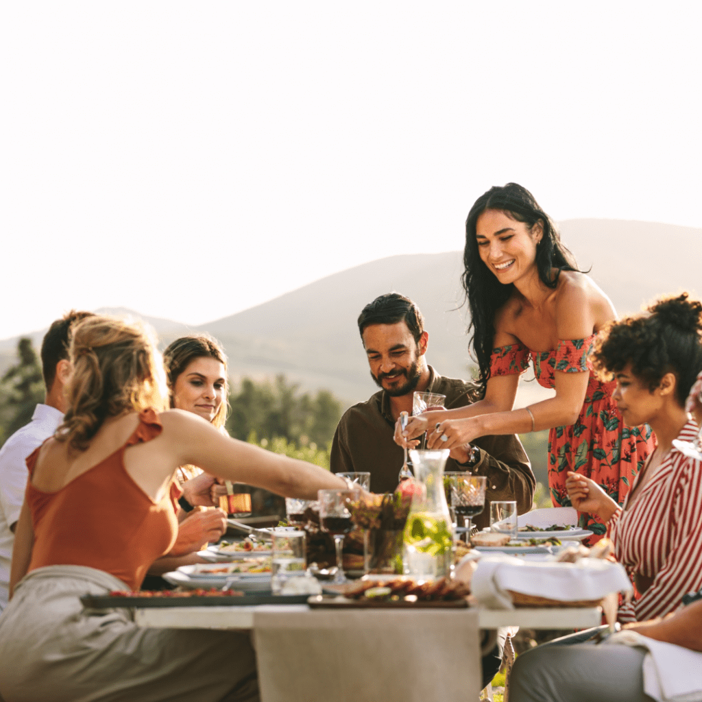 Italian dinner party with host standing